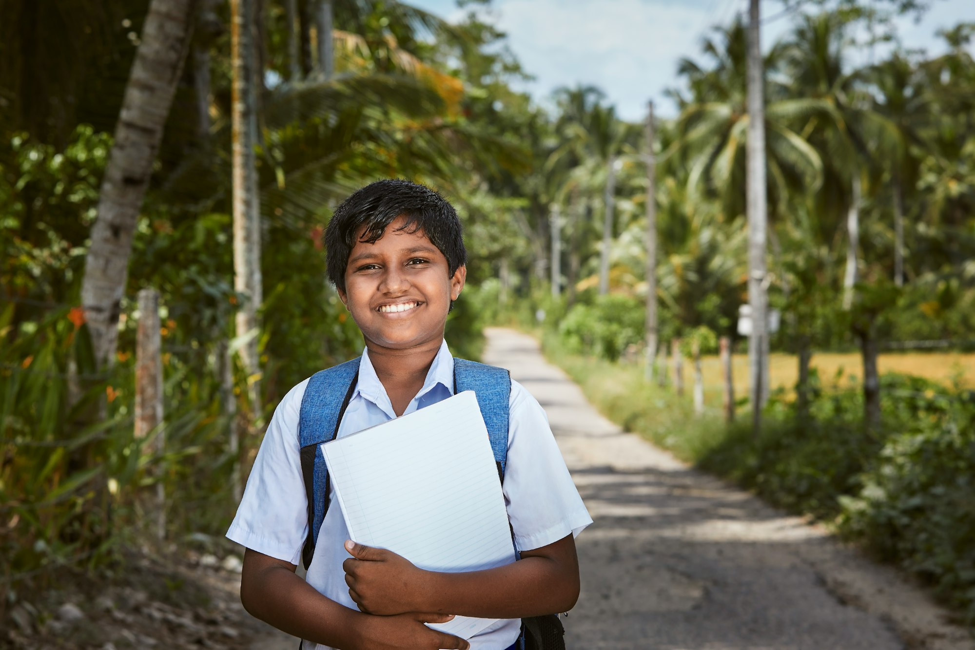 Schoolboy in uniform is walking to school